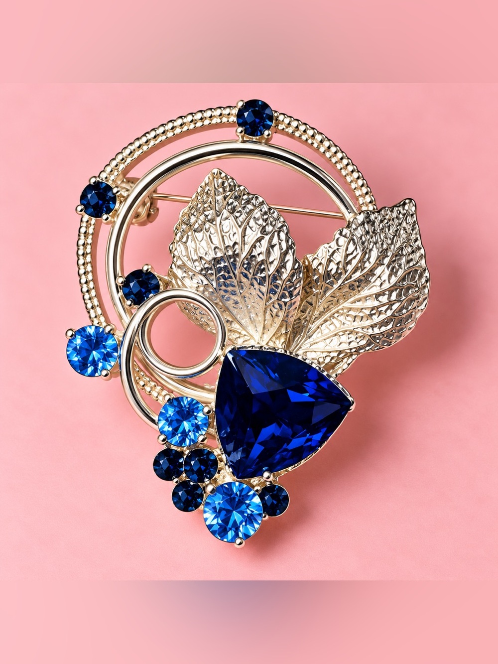 Gold Leaf Brooch with Deep Blue Crystal Accents